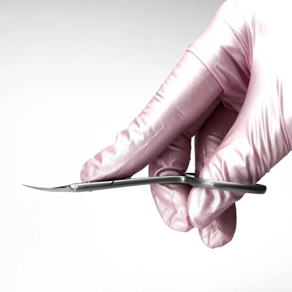 Side view of ergonomic cuticle scissors with curved handle